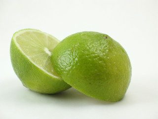green lime sliding apart on white