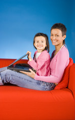 mother and douther with laptop