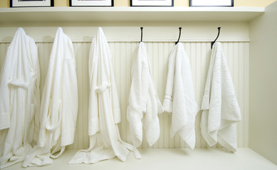 locker room with bathrobes towels