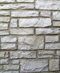 cut rock bricks and mortar background