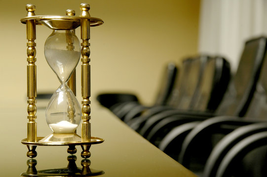 sand clock in the empty board room