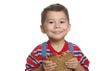 boy with peanut butter and jelly sandwich