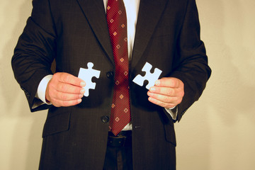 man with jigsaw puzzle