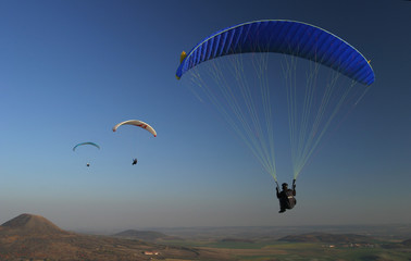 paragliding, three paraglids