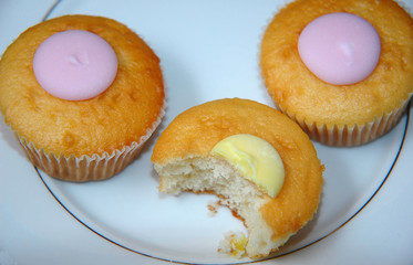 iced cakes, one half eaten