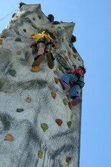 climbers on climbing wall