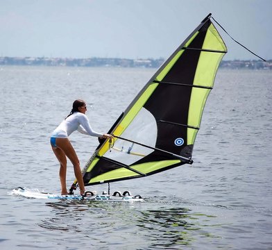 novice lady windsurfer