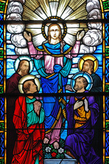 stained glass window of christ and his disciples