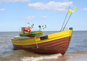 Naklejka na ściany i meble old fishing boats against beautiful sky