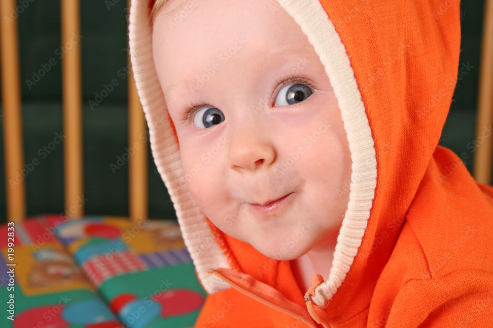 Wall mural smile baby boy with hood