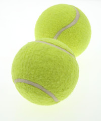 two tennis balls on white
