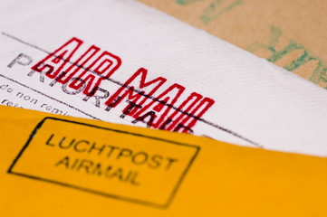 several envelopes with stamps close up