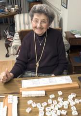 senior woman at the game table
