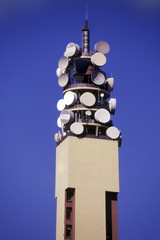 telecommunications tower with satellite dishes