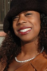 woman in black hat smiling