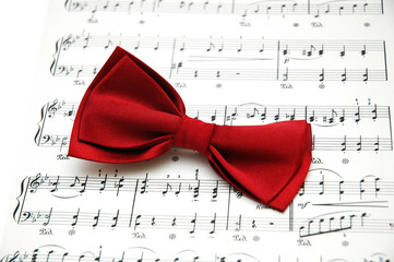 bow tie on sheet of printed music