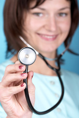 female doctor using stethoscope