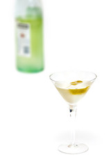 glass with martini and olives and bottle