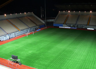 Obraz premium empty soccer stadium in the night