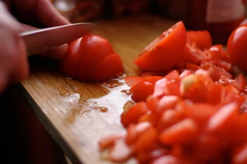 Fotobehang tomatoes slicing - cooking in the kitchen © Jaroslav Machacek