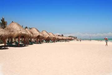 thatched huts on the beach