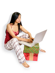 girl on laptop with gifts