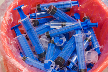 syringe in recycle bin