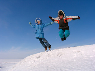 Fototapeta na wymiar jumping boy and girl