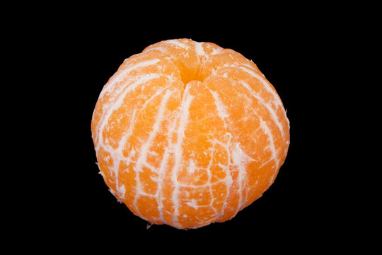 skinless tangerine isolated on black