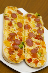 baguettes with pepperoni on the plate