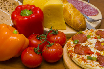 pizza with salami and ingredients