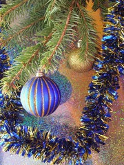a blue ball on a christmas-tree