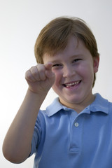 boy smiling and pointing