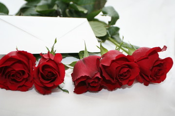 red roses bouquet with  white note
