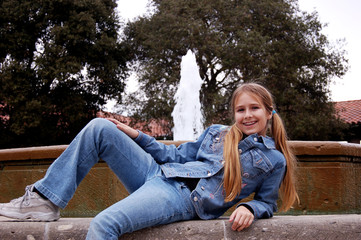 girl in front of fountain
