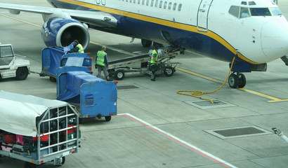 loading baggage onto plane