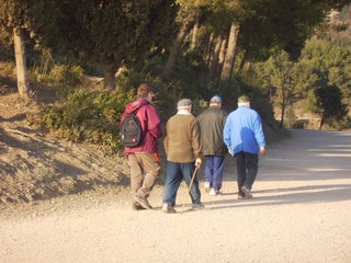 group of young and old men hiking