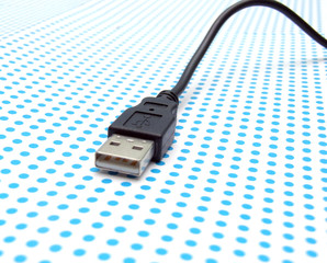 usb cable on dotted background