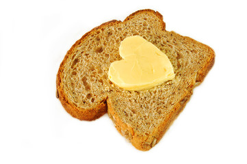seeded wholegrain bread and heart shaped butter.
