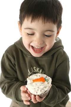 boy eating carrot cupcake