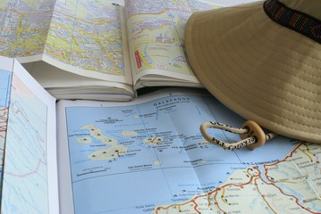 tourist maps and a cap