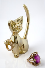 figurine in an image of a cat with gold ornaments
