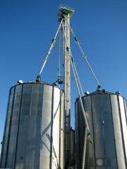 steel grain bin and blue sky