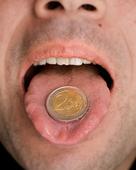 Fototapeta premium 2 euros on the tongue