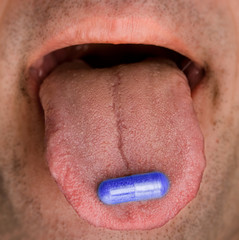 blue pill on the tongue