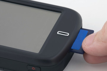 man inserts memory card
