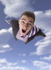 winged businessman flying through the sky