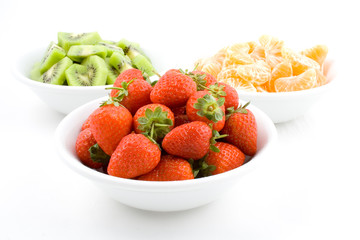 kiwi, strawberry and mandarine, tangerine in white