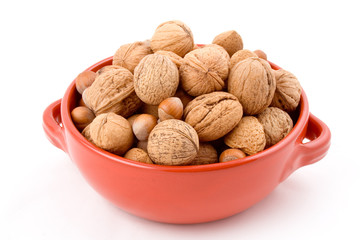 red bowl with mixed nuts, walnuts, hazelnuts, almo
