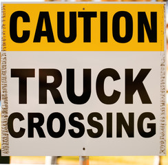 caution truck crossing